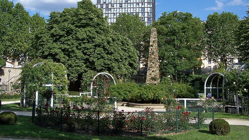 280094-english-view-the-rose-garden-and-the-obelisk-the-square-rene-le-gall-paris-the-background-emerges-the-tour-albert- brown concrete building during night time