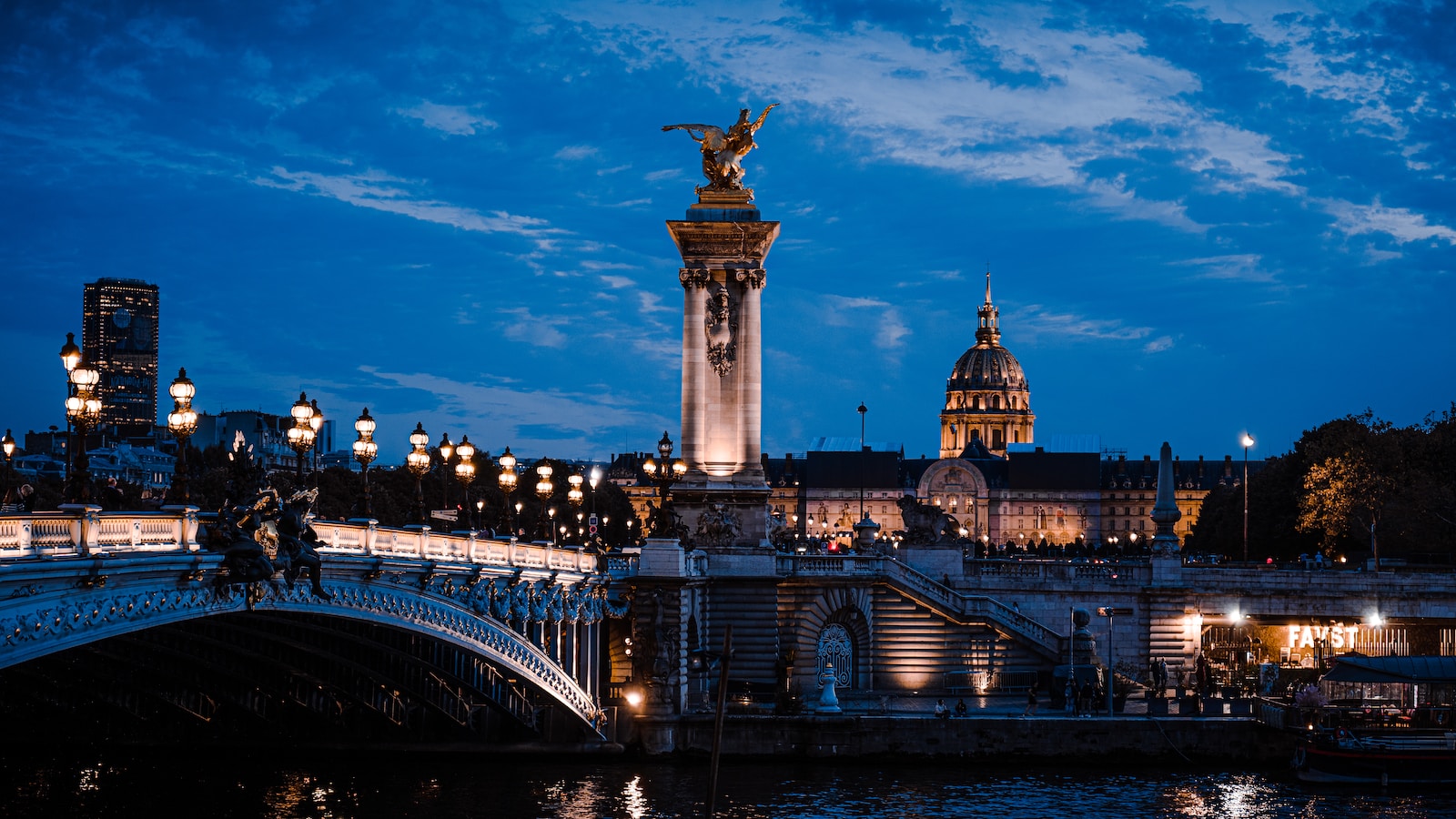 a bridge that has a statue on top of it